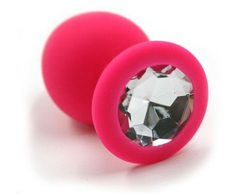 Розовая силиконовая анальная пробка с прозрачным кристаллом - 7 см.