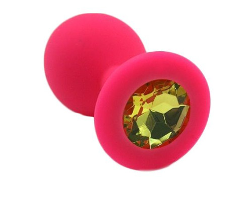 Розовая силиконовая анальная пробка с жёлтым кристаллом - 7 см.