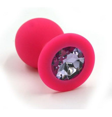 Розовая силиконовая анальная пробка с светло-фиолетовым кристаллом - 7 см.