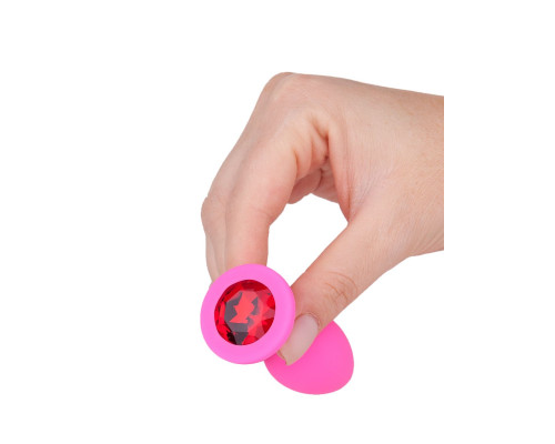 Розовая силиконовая анальная втулка с красным кристаллом - 7,3 см.