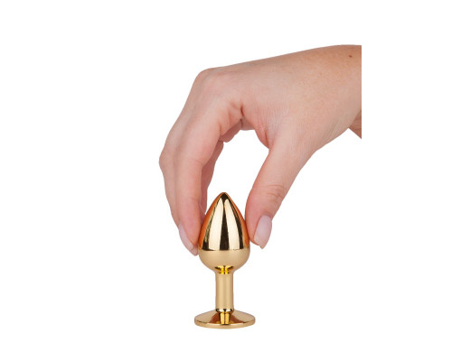 Золотистая анальная втулка с малиновым кристаллом - 7 см.