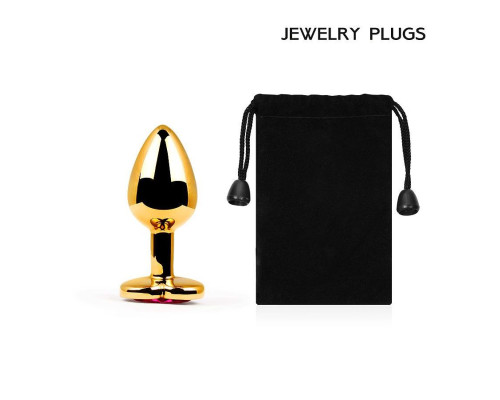 Золотистая анальная пробка с малиновым кристаллом-сердечком - 7 см.