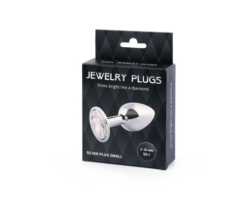 Серебристая анальная пробка с прозрачным стразом - 7,2 см.